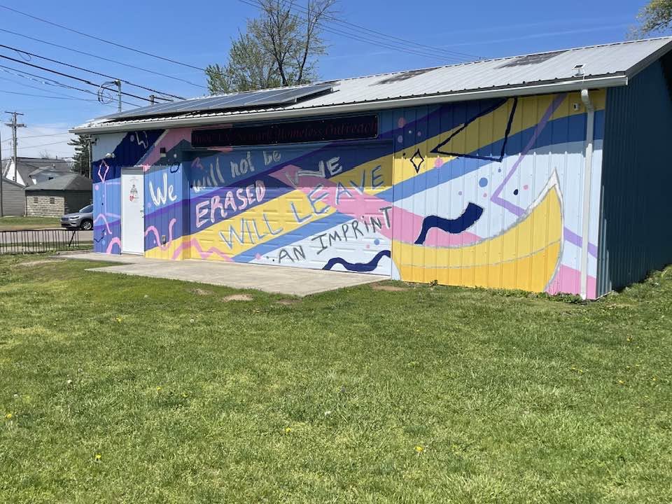 Newark Homeless Outreach building with mural reading 'We will not be erased; we will leave an imprint'